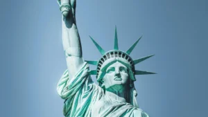 Close-up of the Statue of Liberty holding torch against clear blue sky