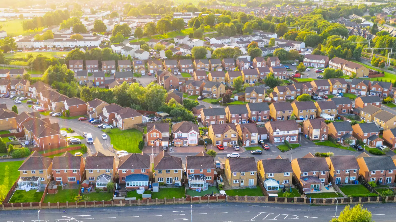 Drone shot of residential neighborhood with rows of detached houses