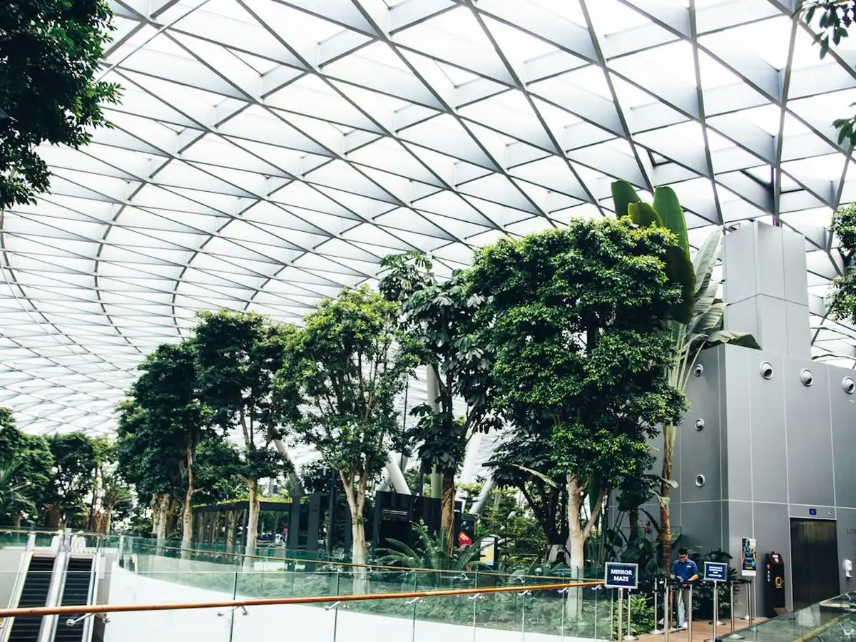 Indoor tropical garden with glass domed roof at a Singapore airport terminal