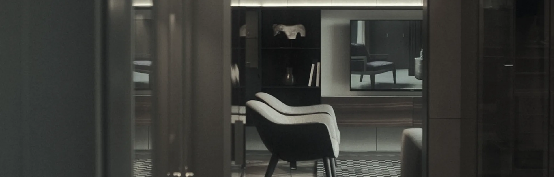 Dimly lit private office lounge with an armchair