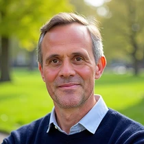Portrait of Justin Whitelock, founder of Mortgage London, standing in a park