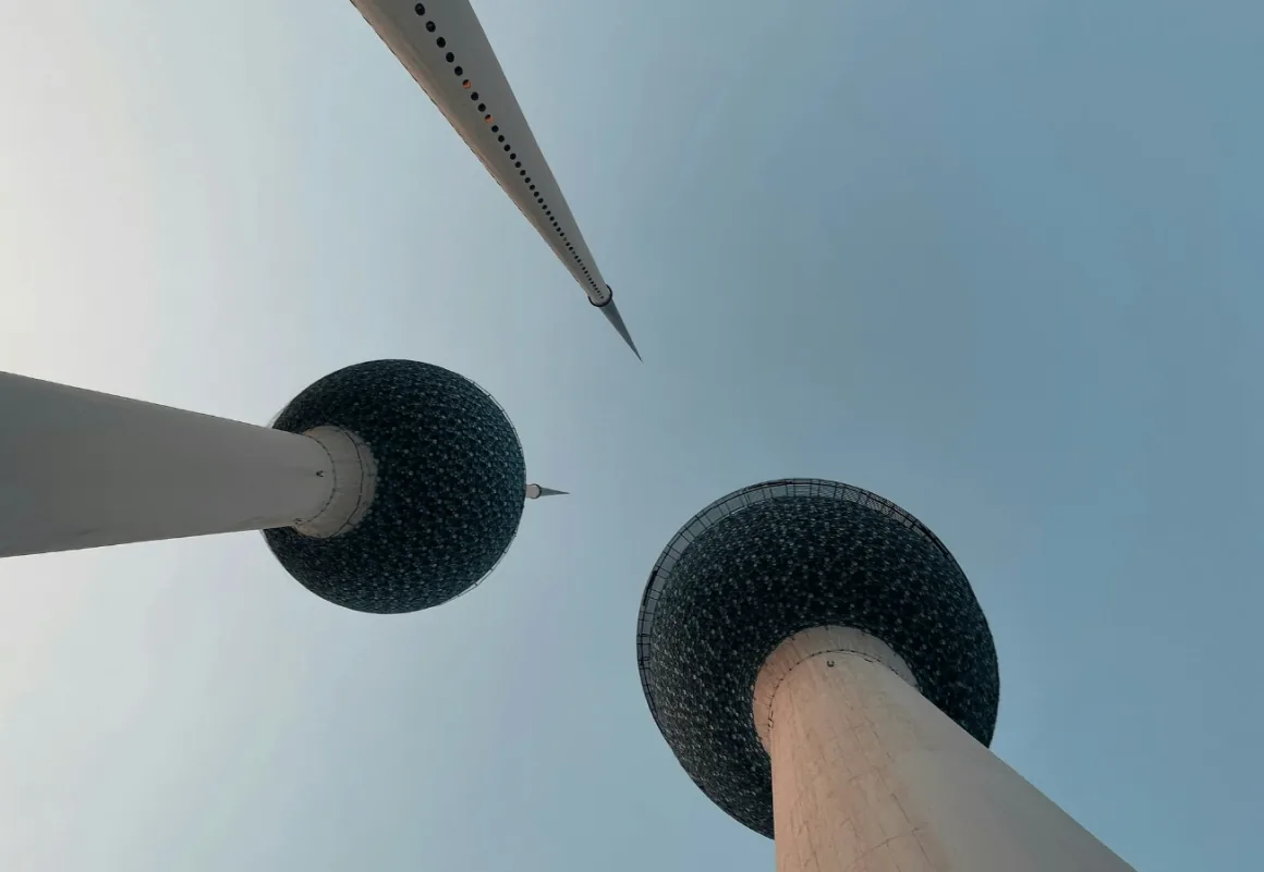 Kuwait Towers seen from below against a clear sky
