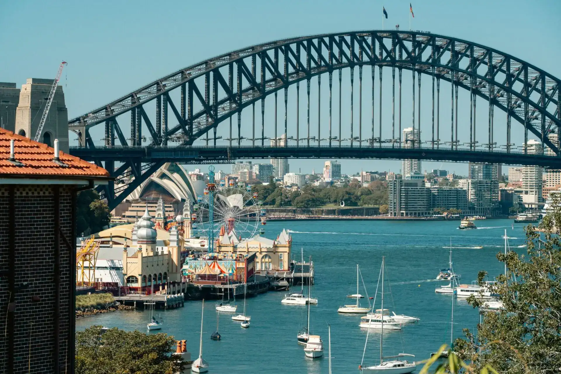 Sydney Harbour Bridge above boats in the harbour