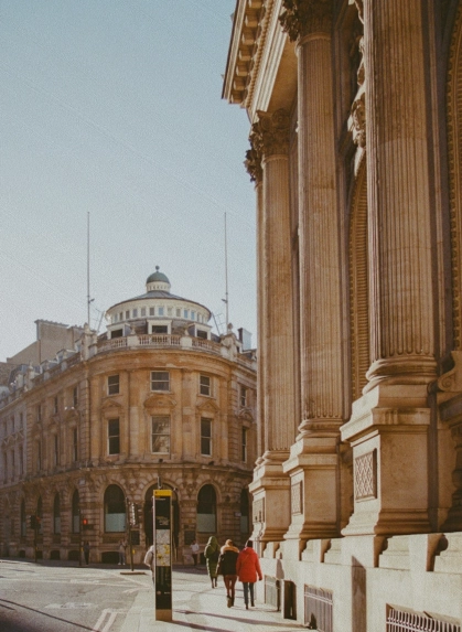 Classical stone columns and period architecture on a City of London street, near Mortgage London's offices