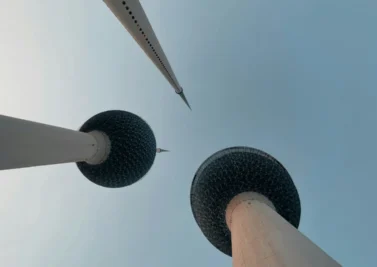 Kuwait Towers seen from below against a clear sky